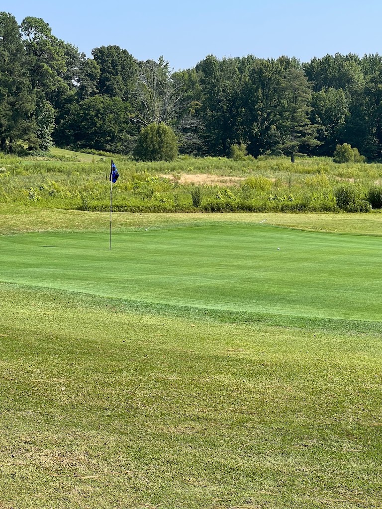 Panoramic view of a lush green golf course at Kentucky Dam Golf Course. Smooth