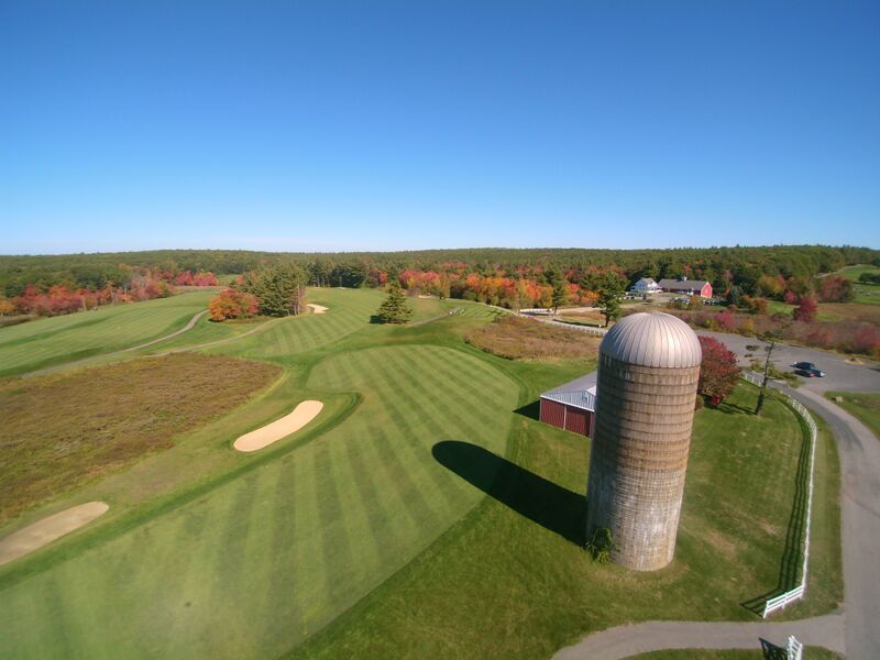 Panoramic view of a lush green golf course at Kettle Brook Golf Club. Smooth