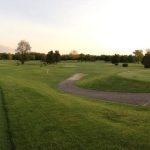Panoramic view of a lush green golf course at Kettle Moraine Golf Club. Smooth
