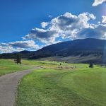Panoramic view of a lush green golf course at Keystone Ranch Golf Course. Smooth