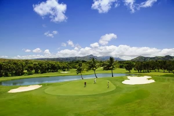 Panoramic view of a lush green golf course at Kiahuna Golf Club. Smooth