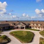 Panoramic view of a lush green golf course at Kiawah Island Golf Resort. Smooth