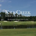 Panoramic view of a lush green golf course at Kiln Creek Golf Club and Resort. Smooth