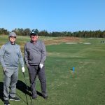 green grass with the flag in the hole.