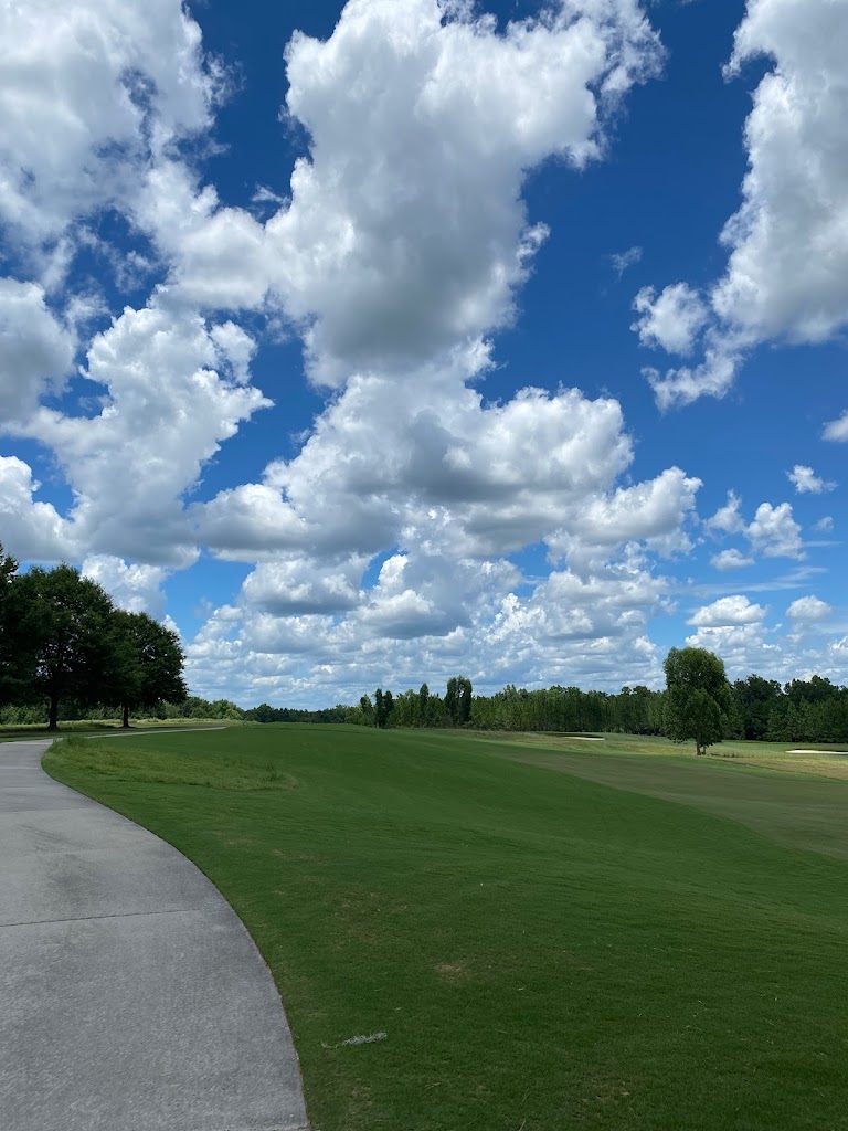 Panoramic view of a lush green golf course at Kinderlou Forest Golf Club. Smooth