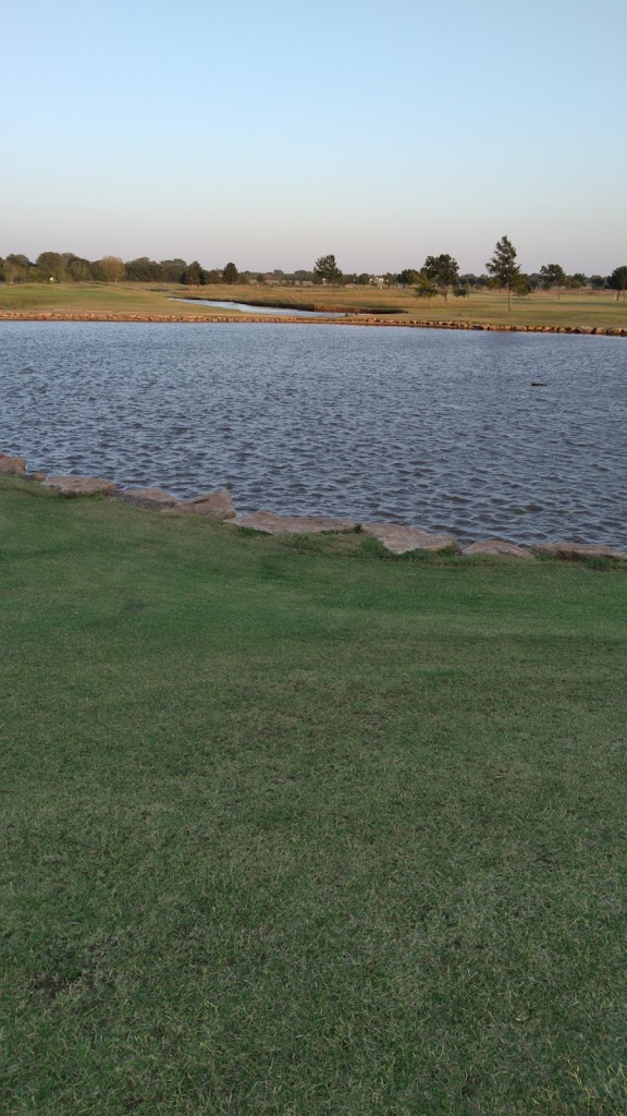 Panoramic view of a lush green golf course at Kingfisher Golf Club Inc. Smooth