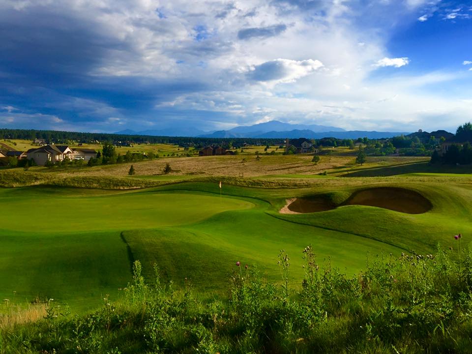 Panoramic view of a lush green golf course at King's Deer Golf Club. Smooth