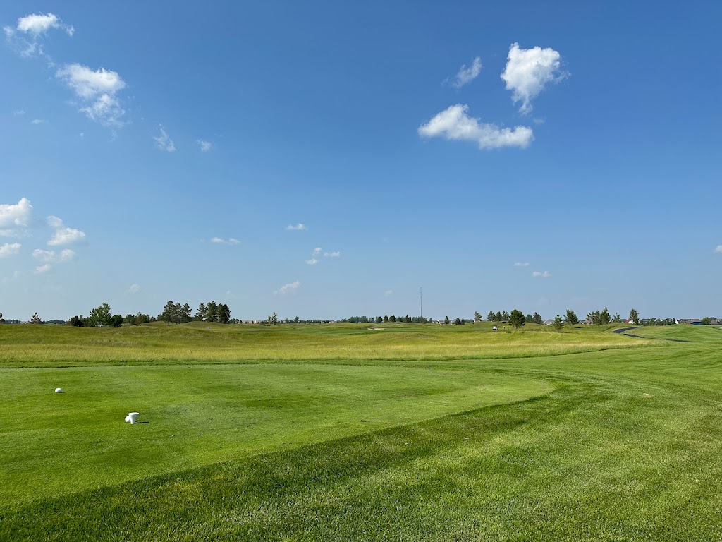 Panoramic view of a lush green golf course at King's Walk Golf Course. Smooth