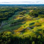 Panoramic view of a lush green golf course at Kingsley Club. Smooth