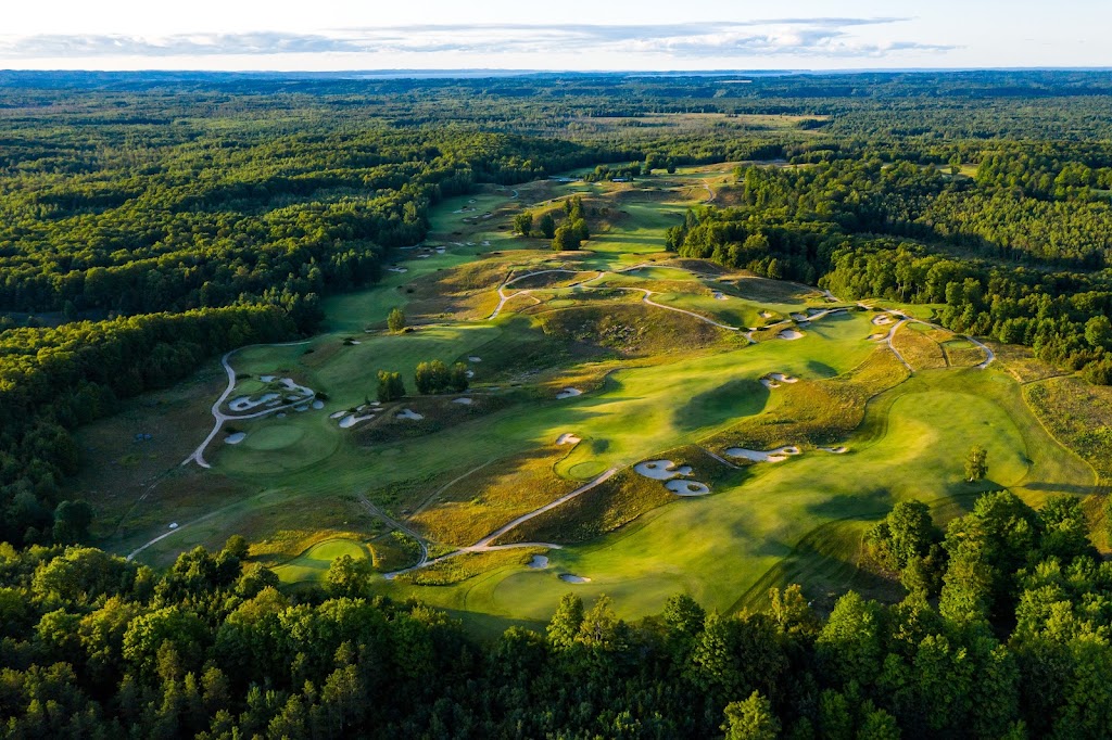 Panoramic view of a lush green golf course at Kingsley Club. Smooth