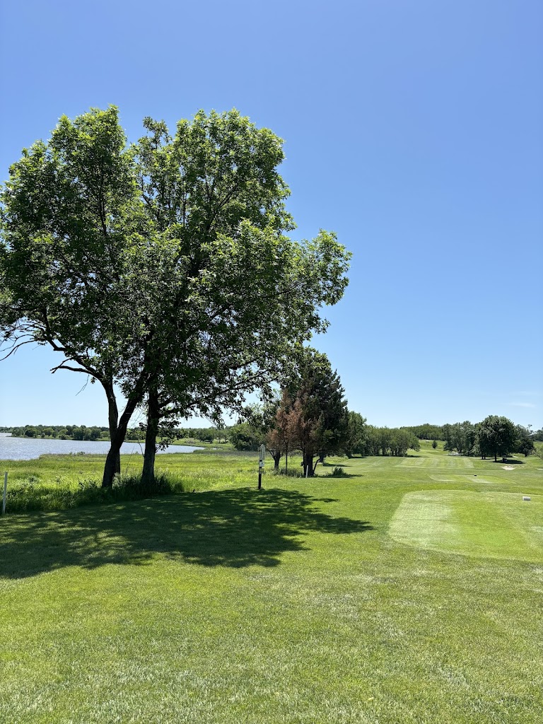 Panoramic view of a lush green golf course at Kirkman's Lakeview Golf Course. Smooth