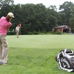 Panoramic view of a lush green golf course at Knoebels Three Ponds Golf Club. Smooth