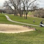 green grass with the flag in the hole.