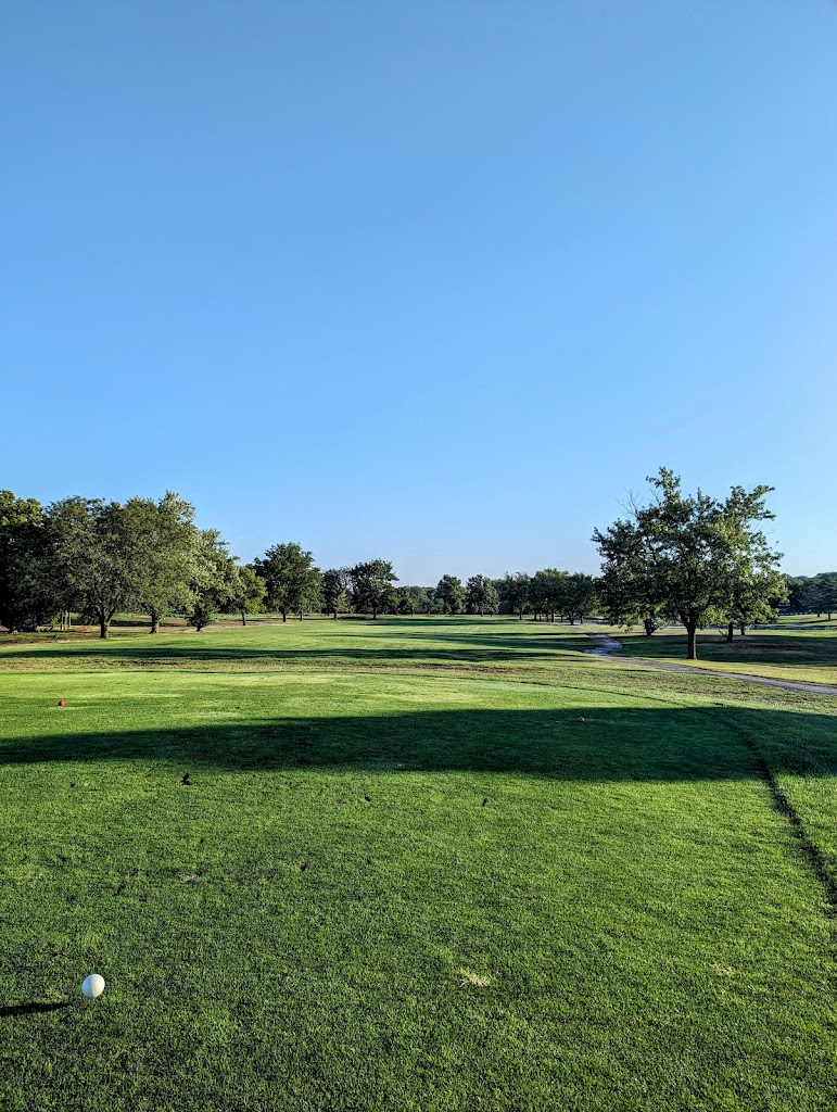Panoramic view of a lush green golf course at Knolls Golf Course. Smooth