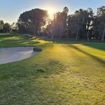 Panoramic view of a lush green golf course at Knollwood Country Club. Smooth