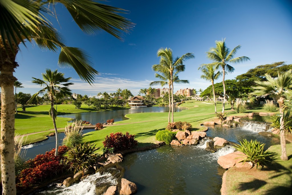 Panoramic view of a lush green golf course at Ko Olina Golf Club. Smooth