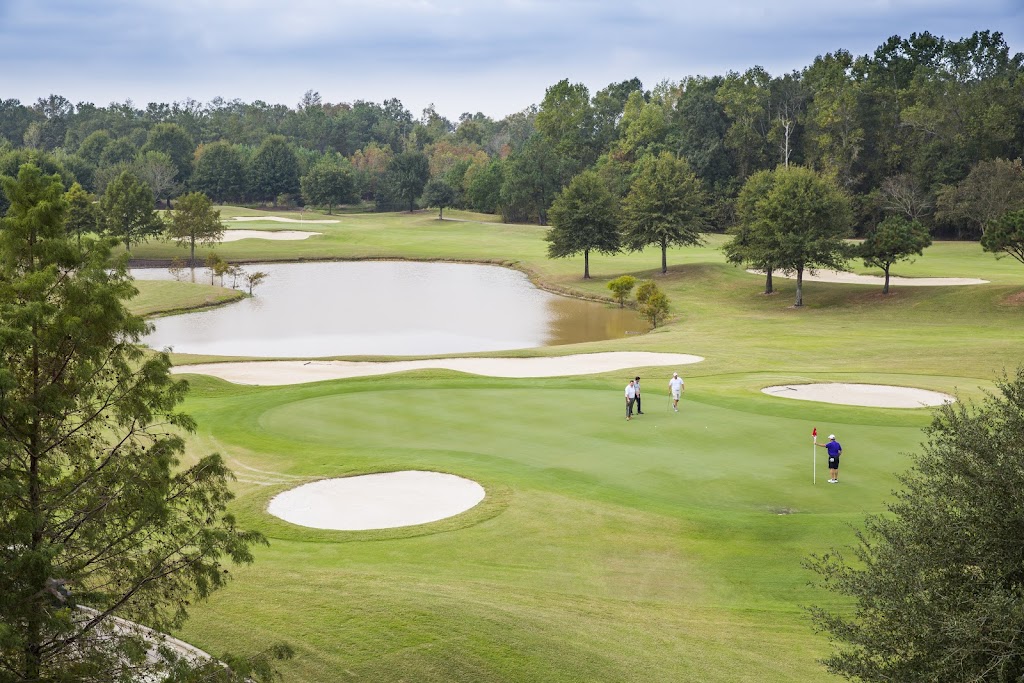 Panoramic view of a lush green golf course at Koasati Pines Golf Club. Smooth