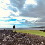 Panoramic view of a lush green golf course at Kona Country Club. Smooth