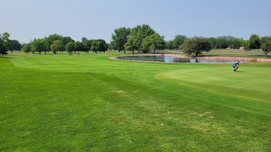 Panoramic view of a lush green golf course at Kuehn Park Golf Course. Smooth