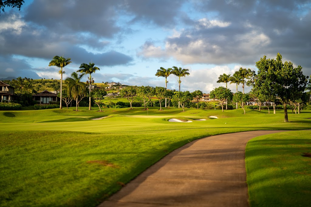 Panoramic view of a lush green golf course at Kukui`ula Golf Course. Smooth