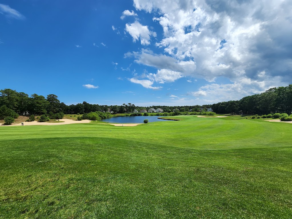 Panoramic view of a lush green golf course at LBI National Golf & Resort. Smooth