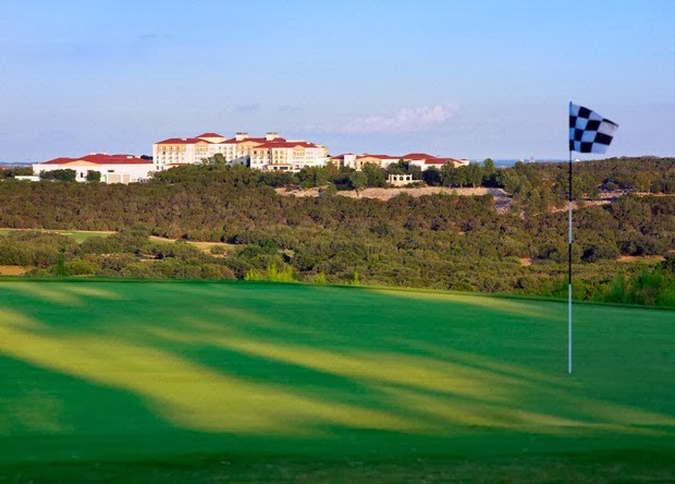 Panoramic view of a lush green golf course at La Cantera Golf Club. Smooth