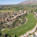 Panoramic view of a lush green golf course at La Paloma Country Club. Smooth