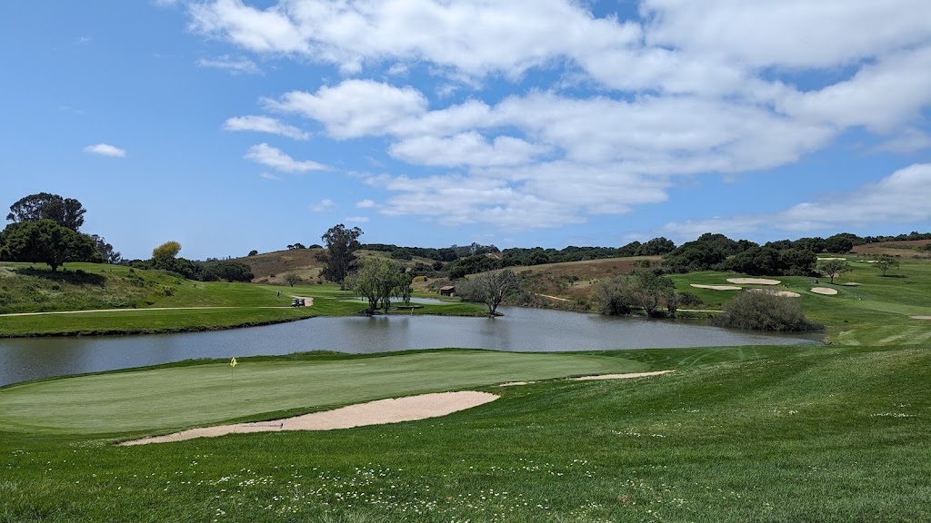 Panoramic view of a lush green golf course at La Purisima Golf Course. Smooth