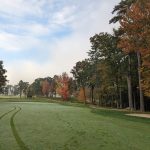 Panoramic view of a lush green golf course at Laconia Country Club. Smooth