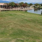 Panoramic view of a lush green golf course at Ladera Golf Course. Smooth