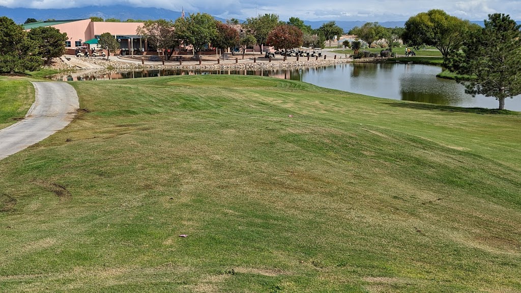 Panoramic view of a lush green golf course at Ladera Golf Course. Smooth
