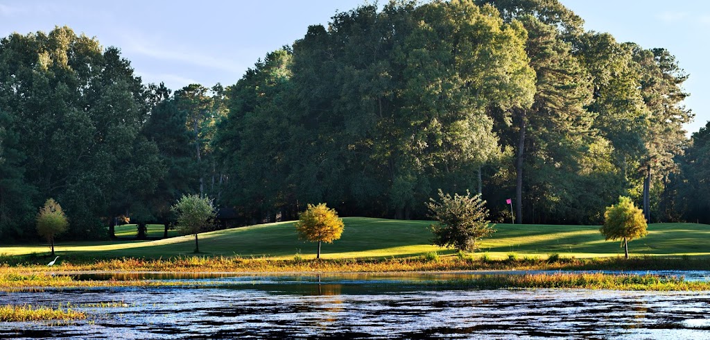 Panoramic view of a lush green golf course at Lagoon Park Golf Course. Smooth