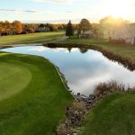 Panoramic view of a lush green golf course at Lake Arbor Golf Course. Smooth