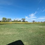 Panoramic view of a lush green golf course at Lake Hefner Golf Club. Smooth