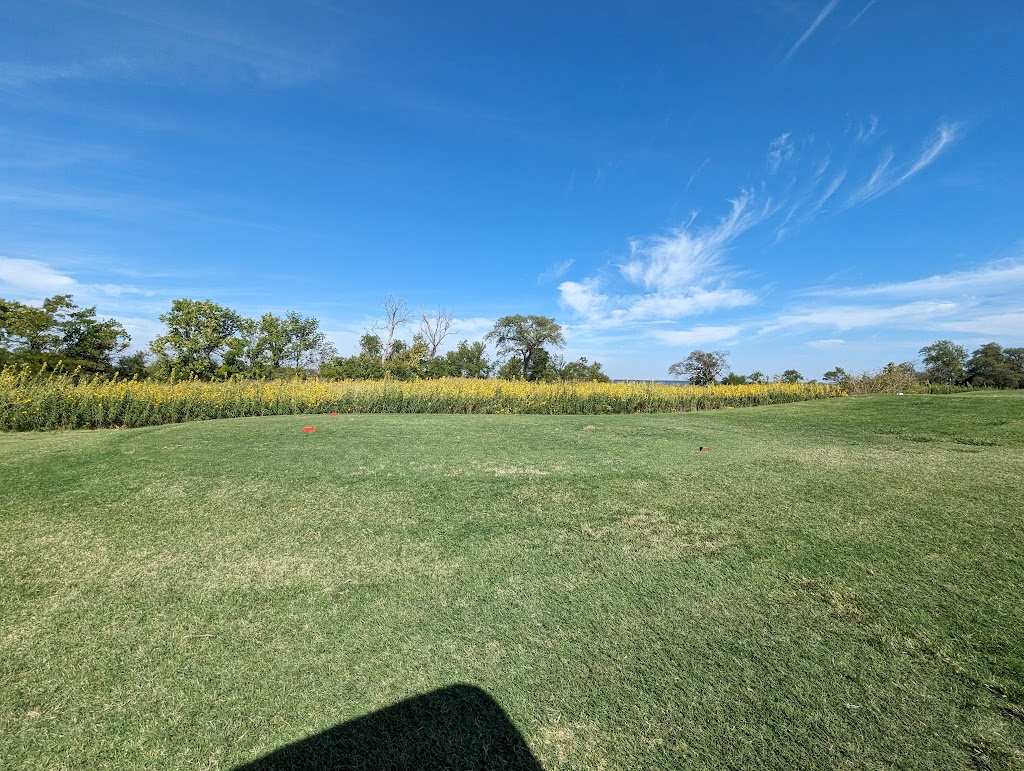 Panoramic view of a lush green golf course at Lake Hefner Golf Club. Smooth