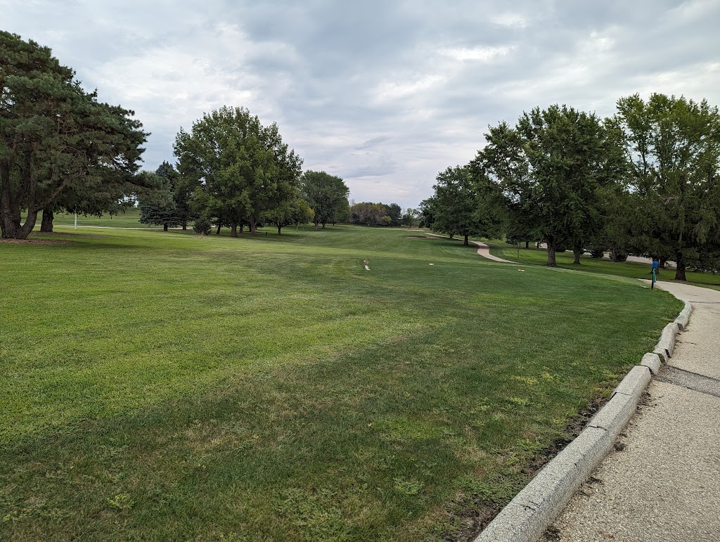 Panoramic view of a lush green golf course at Lake Panorama National Golf Course. Smooth