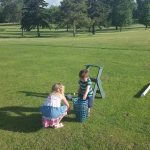 Panoramic view of a lush green golf course at Lake Region Golf Course. Smooth