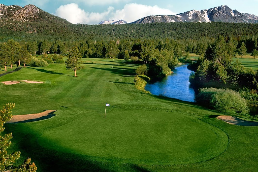 Panoramic view of a lush green golf course at Lake Tahoe Golf Course. Smooth