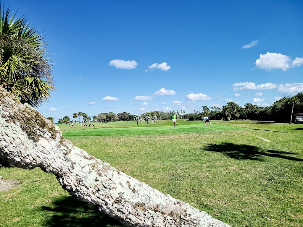 Panoramic view of a lush green golf course at Lake Venice Golf Club. Smooth