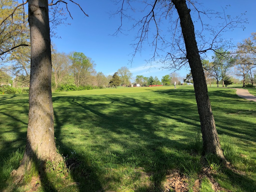 Panoramic view of a lush green golf course at Lake of the Woods Golf Course. Smooth