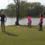 green grass with the flag in the hole.