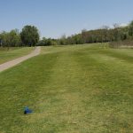 Panoramic view of a lush green golf course at Lakeside Golf Course. Smooth