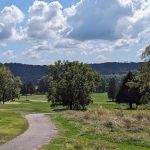 Panoramic view of a lush green golf course at Lakeside Golf Course. Smooth