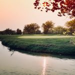Panoramic view of a lush green golf course at Lakeside Golf Course. Smooth