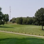 Panoramic view of a lush green golf course at Lakeview Golf Course. Smooth