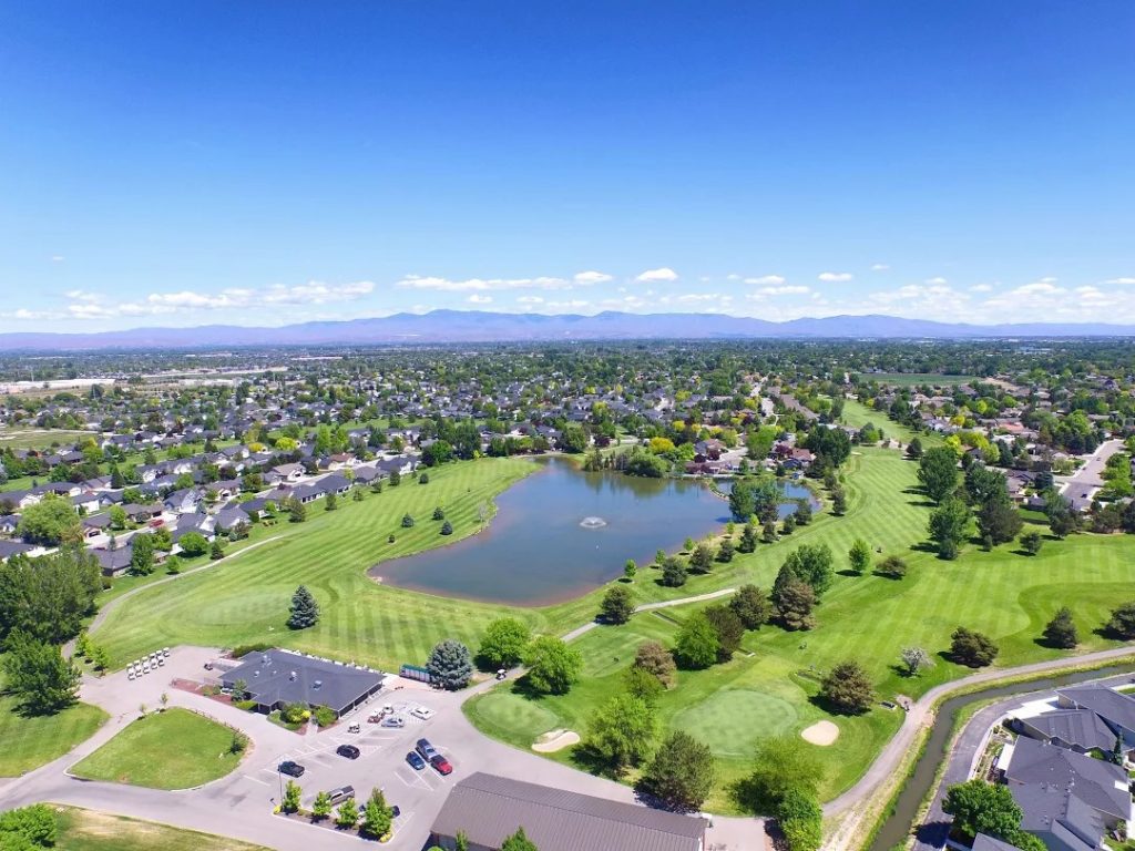Panoramic view of a lush green golf course at Lakeview Golf Course. Smooth