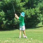 green grass with the flag in the hole.