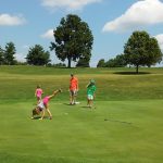 Panoramic view of a lush green golf course at Lakeview Springs Golf. Smooth