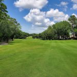 Panoramic view of a lush green golf course at Lakewood Golf Club. Smooth
