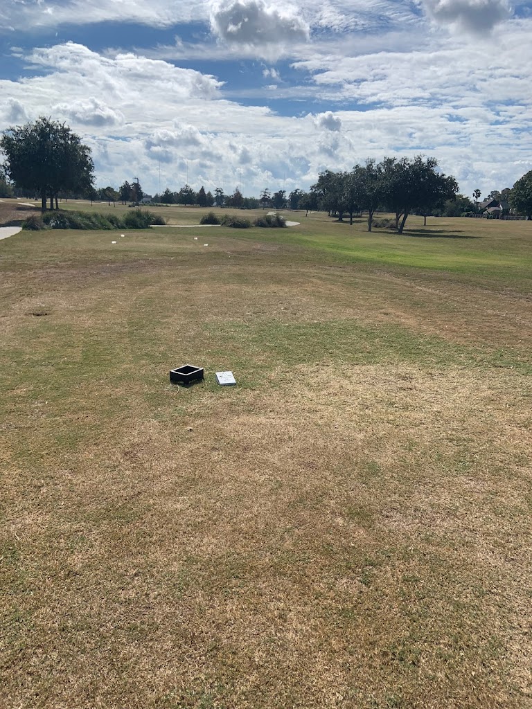 Panoramic view of a lush green golf course at Lakewood Golf Club. Smooth